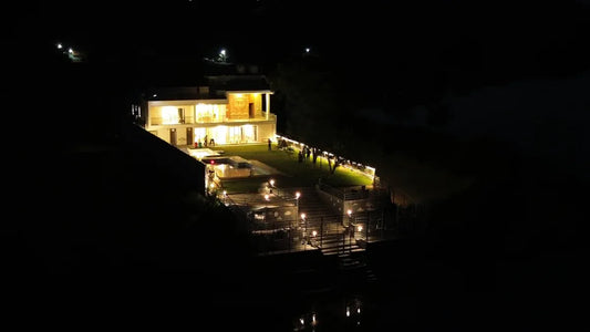Modern home illuminated by outdoor sensor lights for contemporary homes at night.