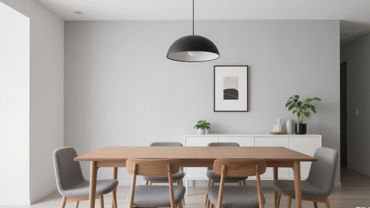 Modern home lighting solutions featuring a stylish black pendant lamp over a wooden dining table in a minimalist space.