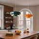 modern kitchen with colorful pendant lights and a wooden island to help you choose perfect kitchen island
