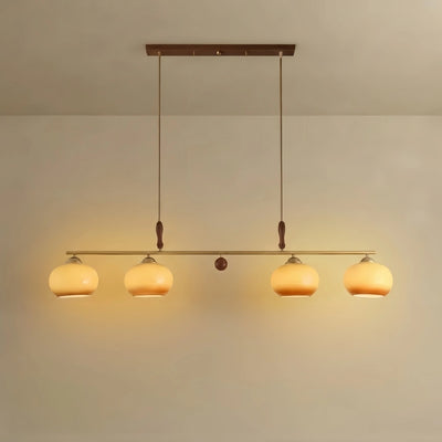 Moderne Pendelleuchte – Bernsteinfarbene Glasschirme & Messingstange mit Holz-Akzent für Esstisch